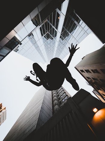 silhouette of person jumping during daytime