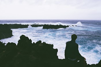 Silhouette Of Person Near Body Of Water