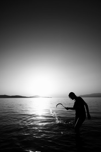 Silhouette of Person on Body of Water