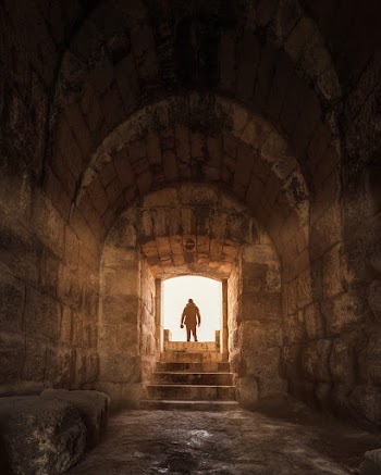 Silhouette of Person Seen Through the Tunnel