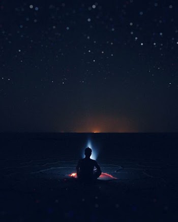 silhouette of person sitting on shore beside bonfire digital painting