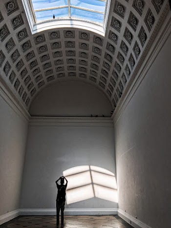 Silhouette Of Person Standing Inside Empty Room