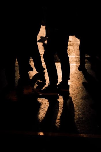 silhouette of person standing on ceramic flooring