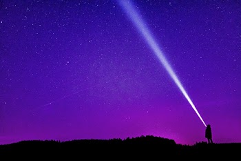 Silhouette of Person Under Blue and Purple Sky