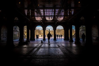 Silhouette of Person Walking in Concrete Building