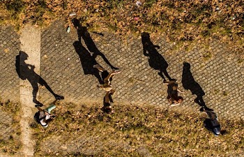 silhouette of person walking in the street