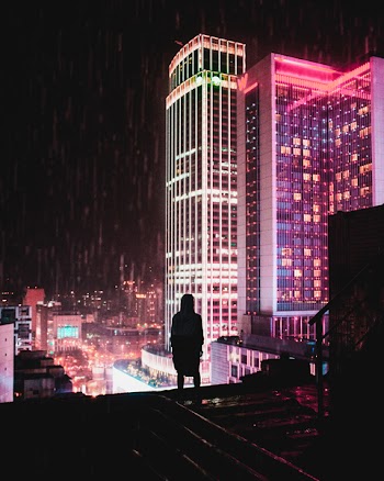 Silhouette of Person Wearing Hooded Top