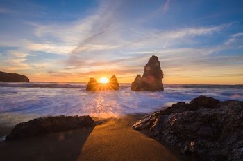 silhouette of rock formations at sunset
