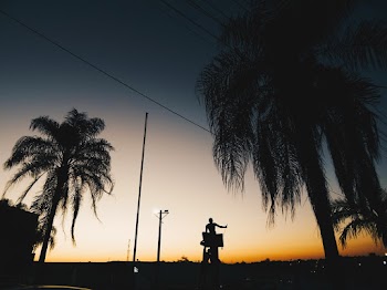 Silhouette  of Two Persons during Golden Hour