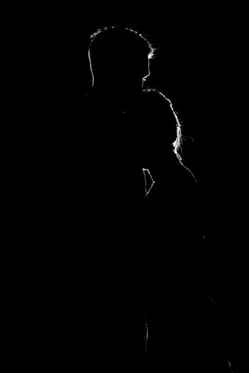 Silhouette of Woman Leaning on Man