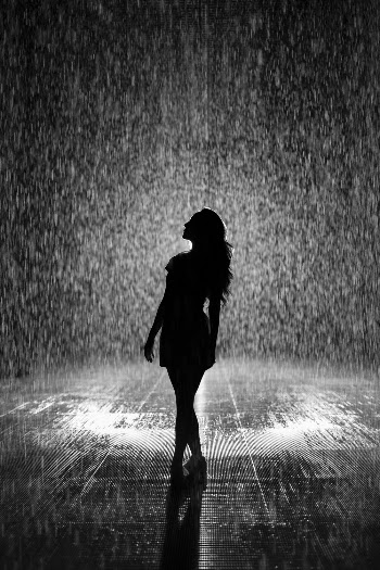 Silhouette Of Woman Under Rain
