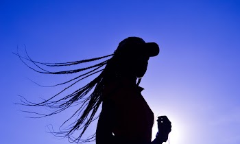 Silhouette of Woman Wearing Cap