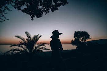 Silhouette of Woman Wearing Hat
