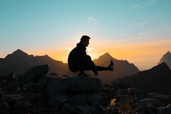 silhouette on man on mountain