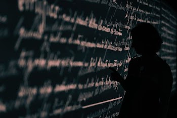 silhouette on person writing