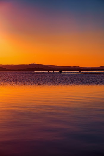 Silhouette Photo of Black Mountain Ranges and Ocean Water