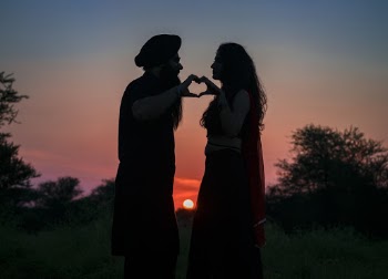 Silhouette Photo of Couple Making a Heart Shape