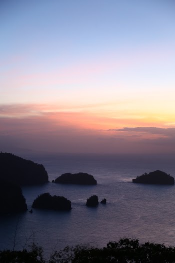 Silhouette Photo of Islands During Golden Hour