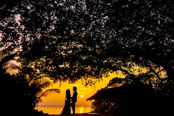 Silhouette Photo of Man and Woman during Sunset