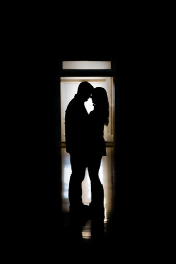 Silhouette Photo Of Man And Woman Facing Each Other
