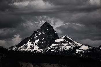 silhouette photo of mountain covered with snow