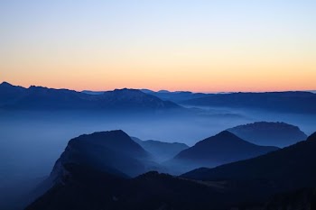 silhouette photo of mountain during dawn