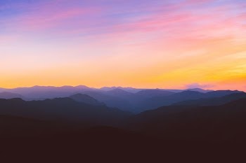silhouette photo of mountain during golden hour