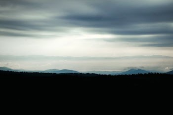 silhouette photo of mountain during night time