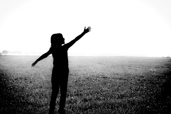 Silhouette Photo of Person Standing Under Rain