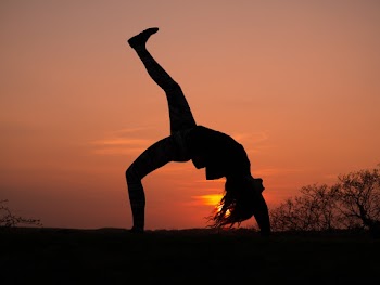 Silhouette Photo of Woman Doing Yoga during Golden Hour