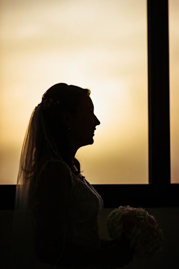 Silhouette Photo of Woman Wearing Bridal Gown Holding Flower Bouquet