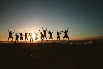 Silhouette Photography of Group of People Jumping during Golden Time · Free Stock Photo