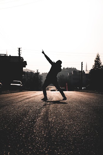 Silhouette Photography of Man in the Middle of the Road