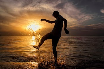 Silhouette Photography of Man on Sea