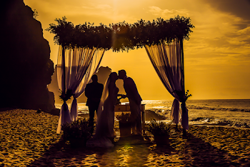 Silhouette Photography of Newly Wed Kissing on Seashore