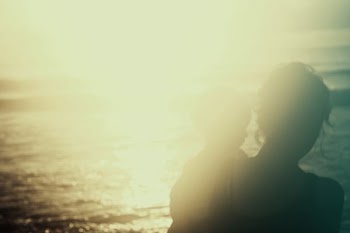 silhouette photography of person carrying a child