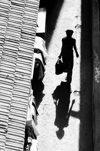 Silhouette Photography of Person Waling on Street