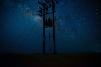 silhouette photography of post during starry night