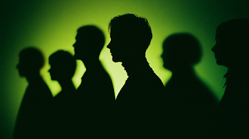 Silhouetted Professionals in an Industrial Setting
