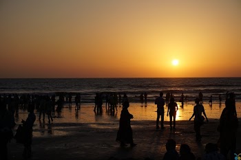 Silhouettes of People on Beach at Sunset