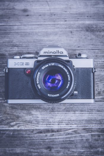 Silver and Black Minolta Camera in Close Up Photography