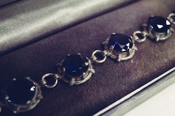 Silver bracelet with blue gems closeup