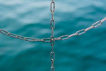 Silver Chain Link on Water · Free Stock Photo
