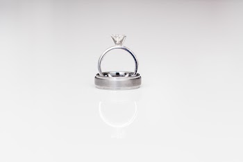Silver-colored Solitaire Bridal Ring Set on White Surface