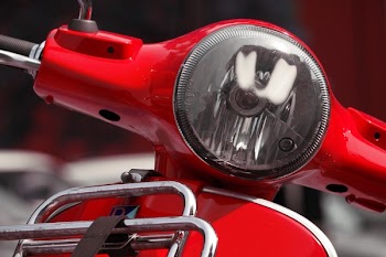 Silver Headlight on Red Motorcycle