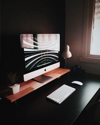 Silver Imac and Wireless Keyboard and Mouse
