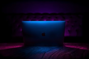 silver iMac on fabric textile