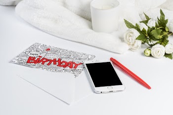 Silver Iphone 6 Beside Red Pen
