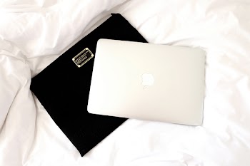 Silver Macbook on Black Case