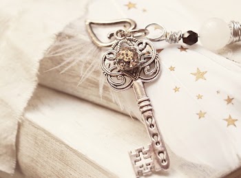 Silver Skeleton Key on White Surface